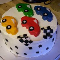 Racing Cake i've never done anything like this one before! i usually just stick to flowers! yellow cake with buttercream. i made extra cake and...
