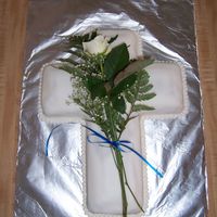 Baptism Cake This is the cake I made for my son's baptism. White/chocolate marble covered in white rolled fondant. The white balls around the base...