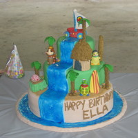 Hawaiian Wonderpets Cake The characters are plastic figures. All other pieces, including the "flyboat" are gumpaste.