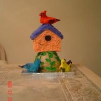 Birdhouse WASC with buttercream. Tree trunk made in Pyrex bowl, house from Wilton 3D house pan. Vines and leaves made with Satin IceFondant. Birds...