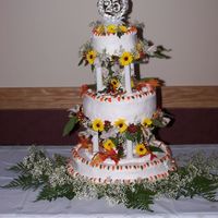 25Th Anniversary Cake My parents renewed their vowels in autumn so we used fall colors. Both of my grandmothers helped. : ) Oh and the flowers are real