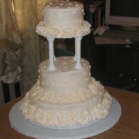 Antique White Wedding Butter Cream on Yellow layers. Made for older couple .