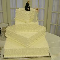 Off Set Square Bride wanted cake square, diamond, square, diamond even though cake didn't sit completely on top of layer underneath. Very unusual,...