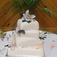 Shan B Cake square, mmf icing, scrolls, ribbons and calla lillys