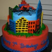 Spiderman My version of the spiderman cake in the Wilton yearbook. fondant buildings and buttercream frosting
