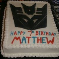 Decepticon Transformer cake for my son's birthday. He helped with the writing!