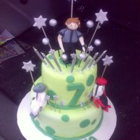Ben 10 Chocolate cake covered in fondant with white chocolate frosting filling. Fondant figurines.