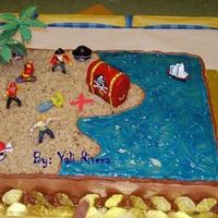 Pirates Pirate almond cake, 11 x 15 pan, all buttercream, coconut sand and blue piping gel for the sea.