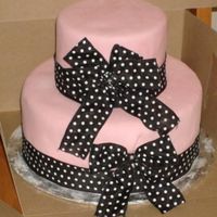 Another Pink And Black Cake 10" and 6" round Pink mmf with black polkadot ribbon and bows. Really upset about this one...the customer never showed up for it...