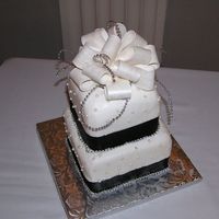 Black And Silver Wedding For a wedding today, chocolate cake, buttercream frosting with fondant beads, satin ribbon and gumpaste bow (my first ever). I decided that...