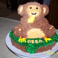 Monkey Birthday Cake This was made using the Wilton 3-D Bear pan on a 10" round. The bear and base are frosted with buttercream with fondant accents. I...