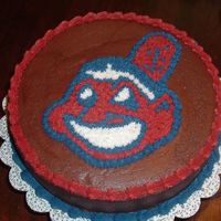 Clevland Indians Did this via a piping gel transfers. Did pattern with tip 18. Also was my first attempt at chocolate frosting.