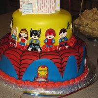 Superhero Cake Superhero cake I made for my son's birthday. The superheros were painted on gumpaste and modelled after his invitation.