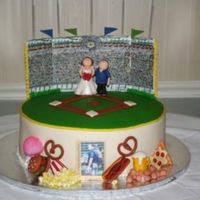 Baseball Stadium Sorry-the other picture was too small! Everything was modeled out of fondant-my first time modeling, ever!!!! The food aroudn the base of...