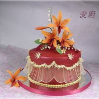 6Th Anniversary Cake Orchid flowers are made with gum paste.8" cake covered with colored fondant.String work is piped with royal icing.