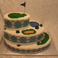Golf Course Cake Oval, three tiered cake with fairway, water and sand trap and the green on top! Buttercream with fondant accents. Flavors are lemon with...