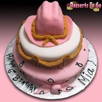 Mia -inspired by cc cake-hat has rice krispys inside. what a pain in the patootie to make this cake but awesome to finish! learning experience...