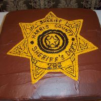 Augustin Groom Cake Pattern transfer of sheriff's badge. choc w/ choc frosting.