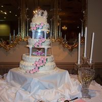 Augustin Wedding 4 tier round with fondant flowers. Very easy to do, but time consuming with the string work.