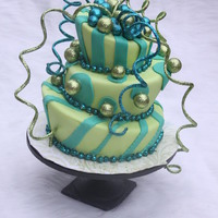 Green Madness Fondant cake with christmas accents all around the outside