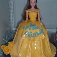 Belle My first doll cake. My fondant was too soft to lay over the whole cake so I layered on a piece at a time. Not exactly what I was going for...