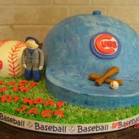 Chicago Cubs Cake Marble Cake, Chocolate Buttercream. Blue Buttercream Icing, Logos and figures done in gumpaste.