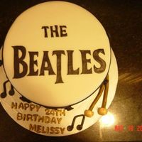 Beatles Drum Carrot Cake, cream cheese filling, fondant. Letters cut out from gum paste. Gum paste drum sticks