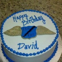 State Police/swat Birthday Cake The wings were inspired by a pin! It's made of fondant with gold luster dust and food color mixed with vodka painted on!!