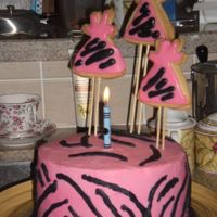 Zebra Birthday Cake This is a yellow cake with buttercream icing. I used sugar cookies to create the birthday hats.