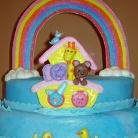 Noah's Arc Fondant coverd cake with fondant/gumtest rainbow, fondant/gumtext animals and fondant clouds.