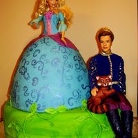 Barbie Island Princess Doll Cake With Prince 2 layered base cake covered in green fondant and fondant/tylose vines and leaves. 6 layered doll cake covered in fondant. Gumtext detail...