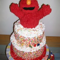 Elmo This is a cake i made for my grandson's 1st birthday. Bottom cake is chocolate with buttercream filling. Top is carrot cake with cream...