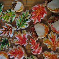 Autumn Cookies, Acorns And Leaves! aww...so pretty - white royal icing with toothpicked wilton gel hand painted on ... some are then further adorned with sprinkles or glitter...