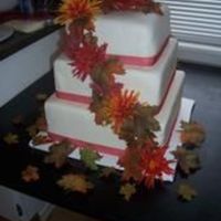 Fall Wedding Cake For a wedding in October. Bride wanted a cake but wanted to serve pumpkin pies, so the bottom 2 layers are dummies. All fondant.