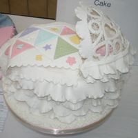 Baby Cradle Cake Baby cradle has a patchwork quilt and a battenburg lace hood.