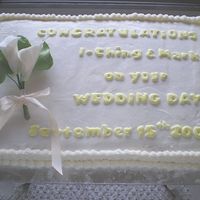 2 Of 2 Church Reception Cakes White gumpaste calla lilies, colourflow letters