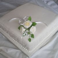 White Roses Can't remember why there wasn't a message on this cake. The dot detail on the sides was very time consuming, but I think it was...