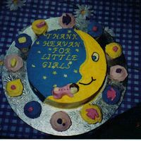 Baby Girl THE BABY ON THE CAKE IS MADE OF CHOCOLATE AND THE CUPCAKES ALL HAVE CHOCOLATE BABY DECORATIONS I.E BOOTS, BOTTLES ECT.