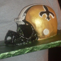 Who Dat! This was my first attempt at a helmet cake for my uncle's 60th birthday. I cheated because it was last minute so the the faceguard is...