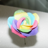 Rainbow Rose I've seen pictures on other sites of real roses dyed to look like a rainbow so I wanted to try it in gumpaste, and I think it turned...