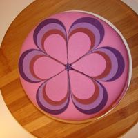 Dsc00620.jpg My niece's birthday cake. It was white cake w/rasberry BC, covered with fondant and fondant flower.