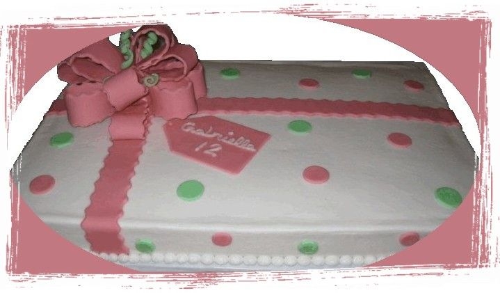 Gift For Gabriella White chocolate cake, buttercream, and fondant bow and polka dots.