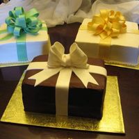 Gift Packages 10" & 8" square, 1/4 sheet halved and stacked. For my first corporate Christmas party. Loved making the bows...they were all...