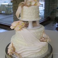 Ajia's Calla Lilies 6-10-14, buttercream icing, fondant swags, gumpaste calla lilies and satin ribbons. Too late I figured out how to make the plates and...