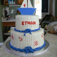 Sail Boat two tiered sail boat cake with nautical symbols. Buttercream icing with fondant decorations.