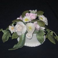 Topper Cake topper for wedding cakejust posted . All gumpaste flowers with gumpaste holder. Holderborder royal icing.