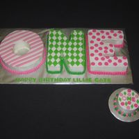 Lillie's One A little different for a 1st birthday. A smaller version of a cake I did a few years ago . cut from 8 inch cakes buttercream with fondant...