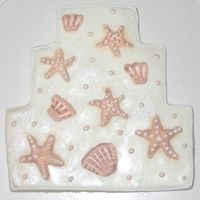 Seashells Wedding Cake Cookie These large wedding cake cookies were made for a beach-themed wedding.