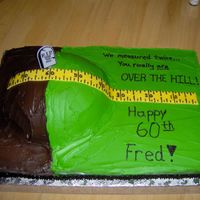 We Measured Twice... Buttercream icing, fondant ruler. Hill was made from the soccer ball pan.