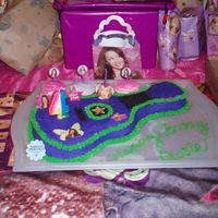 Hannah Montana Made for my daugthers 4th b-day, hannah montana guitar cake pan. cupcakes where easily decorated with airbrush